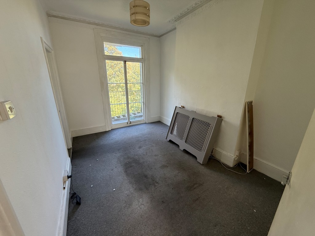 Lot: 172 - VACANT FLAT FOR IMPROVEMENT - Living room with balcony